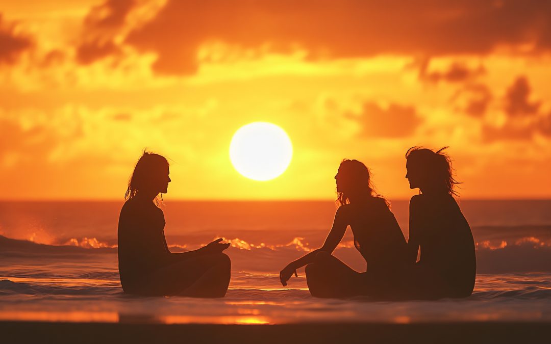 Personnes admirant un coucher de soleil sur une plage tropicale en Guadeloupe